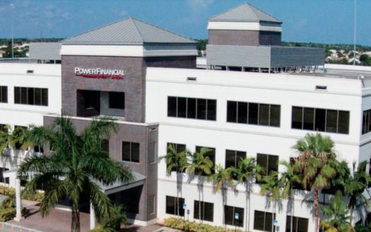 A three story building labeled “Power Financial Credit Union” that has office suites available for lease in Pembroke Pines, Florida.